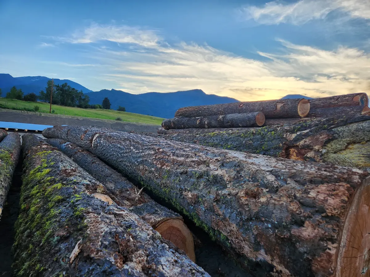 Log deck at sunset with the Bitterroot Mountains beyond